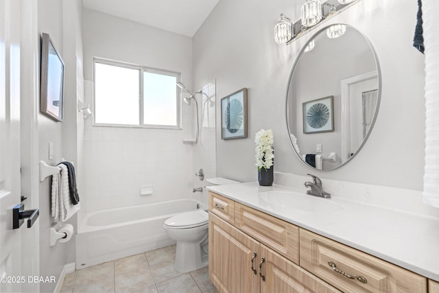 full bathroom featuring vanity, toilet, tiled shower / bath combo, and tile patterned flooring