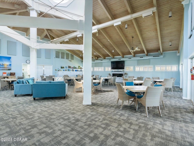 dining room featuring high vaulted ceiling, beamed ceiling, carpet, and wooden ceiling