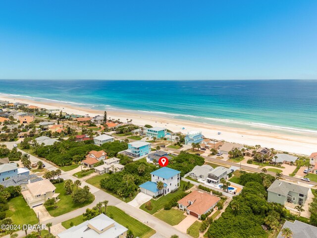 bird's eye view featuring a view of the beach and a water view