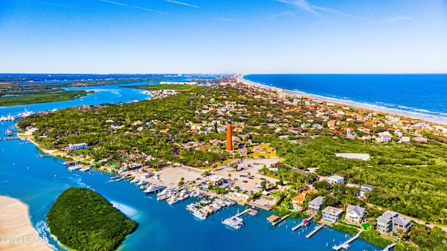 bird's eye view featuring a water view and a view of the beach