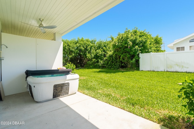 view of yard featuring ceiling fan and a patio