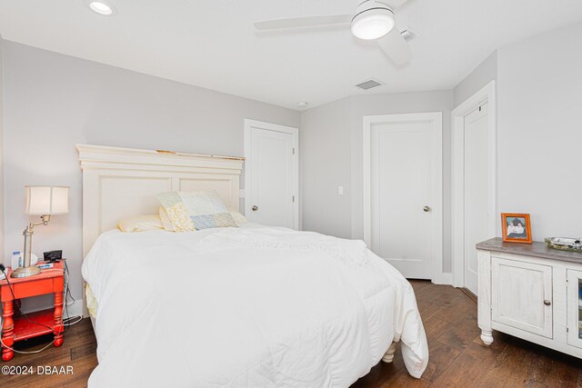 bedroom with ceiling fan and dark hardwood / wood-style floors