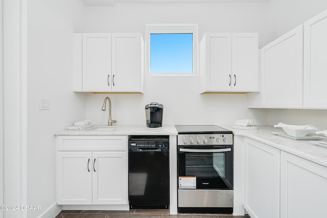 kitchen with white cabinetry, electric range, and light stone counters