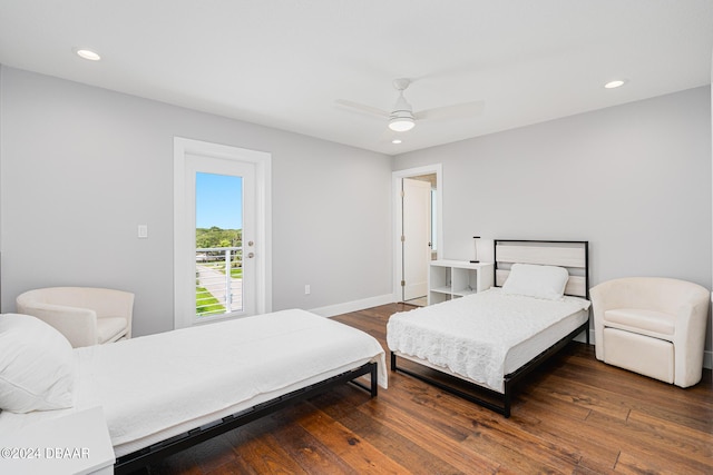 bedroom with dark hardwood / wood-style floors, access to exterior, and ceiling fan