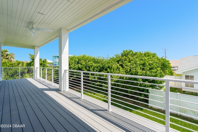 wooden deck featuring ceiling fan