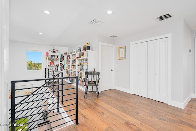 4727 Riverglen Blvd, Ponce Inlet, FL 32127 - corridor with an upstairs landing, light wood-style flooring, recessed lighting, and baseboards