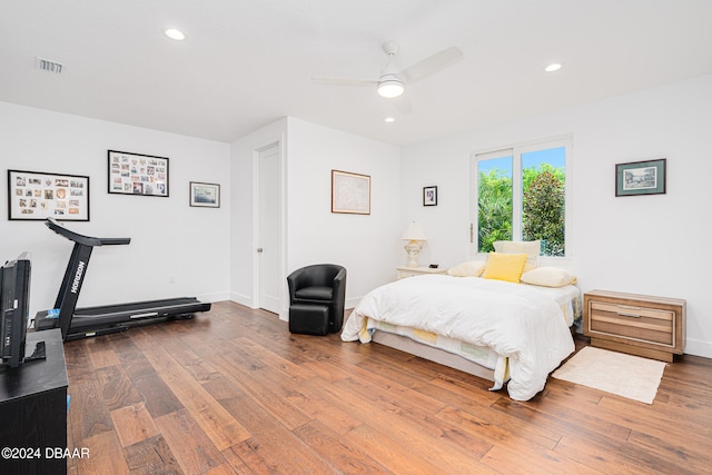 bedroom with ceiling fan and wood-type flooring