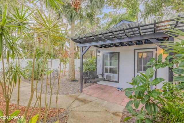 exterior space with cooling unit and a pergola