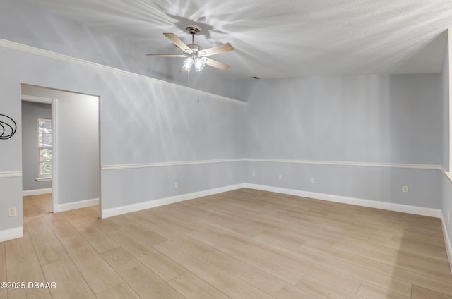 empty room featuring ceiling fan, a textured ceiling, and light hardwood / wood-style flooring