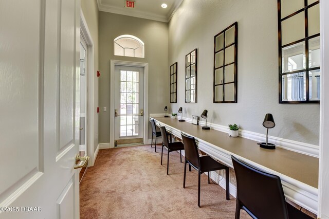 940 Village Trl Unit 5-106, Port Orange, FL 32127 - office space with a towering ceiling, ornamental molding, built in desk, light carpet, and baseboards
