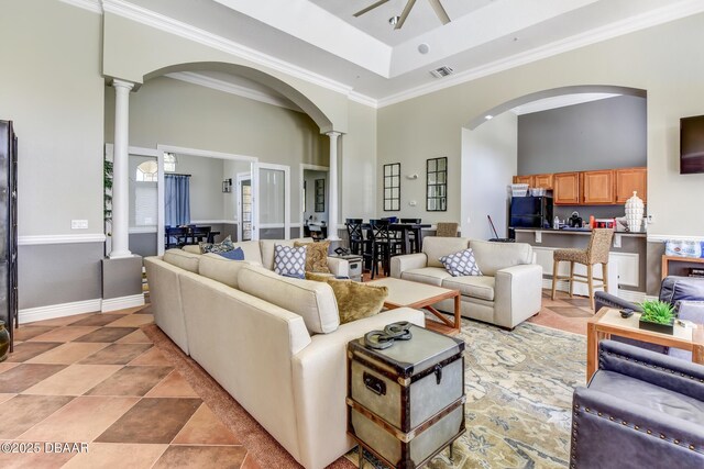 940 Village Trl Unit 5-106, Port Orange, FL 32127 - living area featuring arched walkways, a high ceiling, decorative columns, and visible vents
