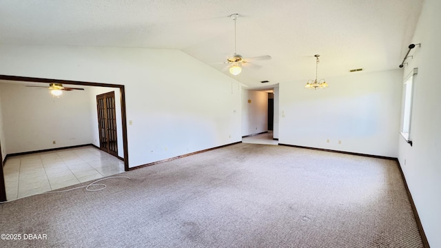 93 Hay Bale Trl, Ormond Beach, FL 32174 - empty room with visible vents, baseboards, light colored carpet, ceiling fan with notable chandelier, and vaulted ceiling