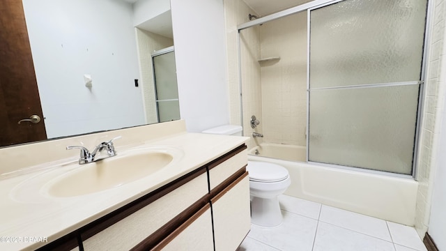 93 Hay Bale Trl, Ormond Beach, FL 32174 - bathroom with toilet, tile patterned floors, combined bath / shower with glass door, and vanity