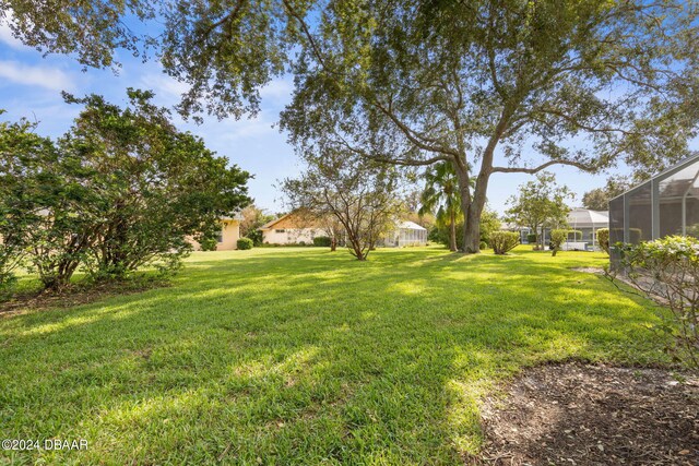 view of yard featuring a lanai