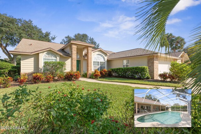 74 Kingsley Ln, Ormond Beach, FL 32174 - ranch-style house featuring glass enclosure, an outdoor pool, a shingled roof, and a front yard