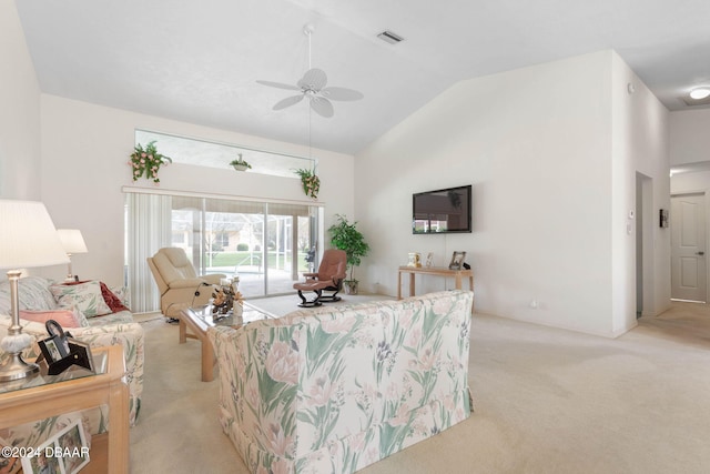 living room with light colored carpet, lofted ceiling, and ceiling fan