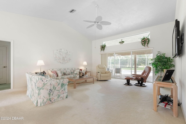 carpeted living room featuring ceiling fan and vaulted ceiling