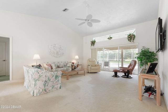 74 Kingsley Ln, Ormond Beach, FL 32174 - living area with light carpet, ceiling fan, and high vaulted ceiling