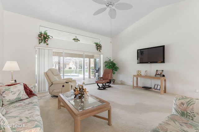 carpeted living room with lofted ceiling and ceiling fan