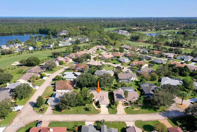 74 Kingsley Ln, Ormond Beach, FL 32174 - aerial view of property and surrounding area with a large body of water and nearby suburban area
