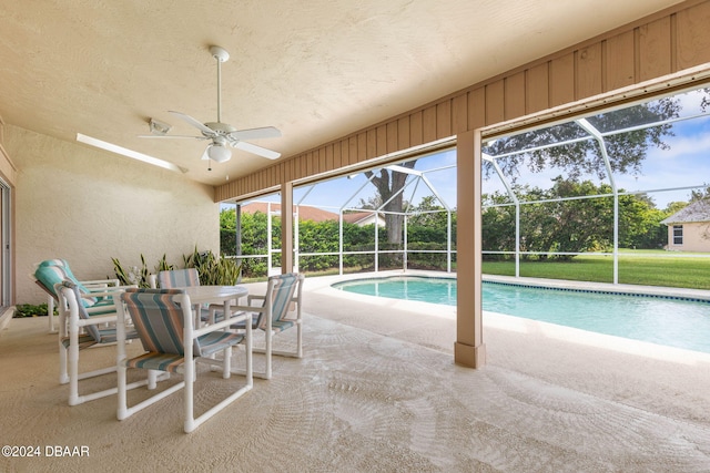 view of pool featuring ceiling fan