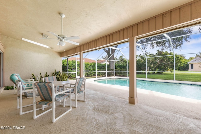 74 Kingsley Ln, Ormond Beach, FL 32174 - swimming pool featuring a ceiling fan, a patio, a lanai, and outdoor dining space