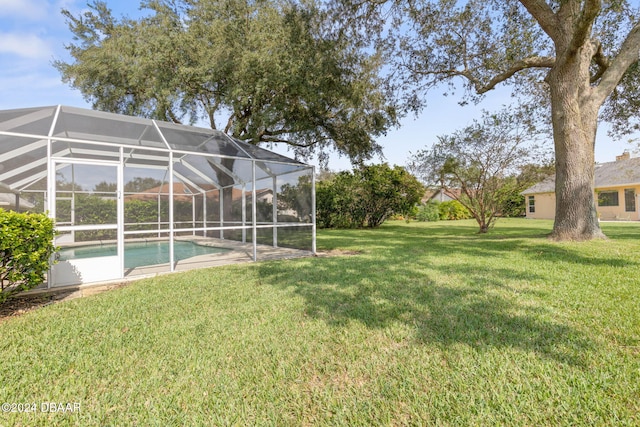 view of yard featuring glass enclosure