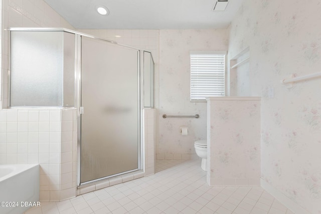 74 Kingsley Ln, Ormond Beach, FL 32174 - bathroom featuring wallpapered walls, tile patterned flooring, a shower stall, and a garden tub