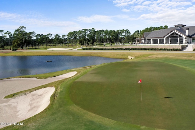 74 Kingsley Ln, Ormond Beach, FL 32174 - view of community featuring a water view, golf course view, an area to practice putting, and view of scattered trees