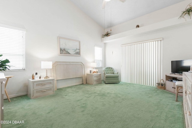 bedroom featuring ceiling fan, multiple windows, and carpet flooring