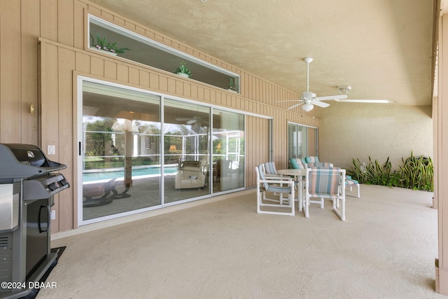 view of patio / terrace with grilling area and ceiling fan