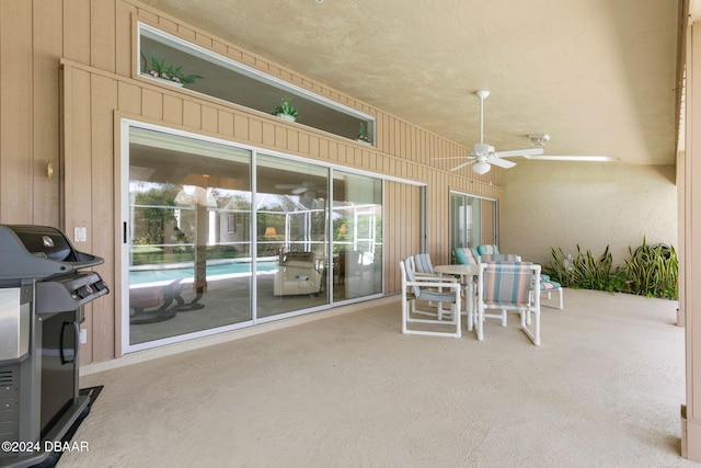 74 Kingsley Ln, Ormond Beach, FL 32174 - view of patio / terrace with a ceiling fan, grilling area, and outdoor dining area