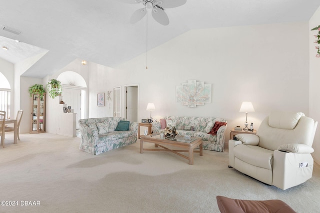 carpeted living room featuring ceiling fan and vaulted ceiling