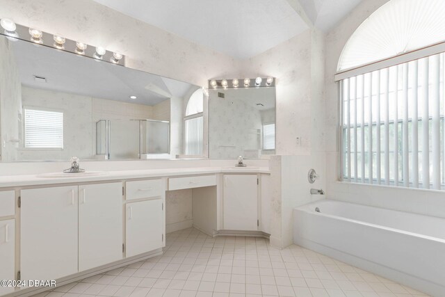 74 Kingsley Ln, Ormond Beach, FL 32174 - full bathroom featuring a bath, double vanity, a shower stall, and tile patterned flooring