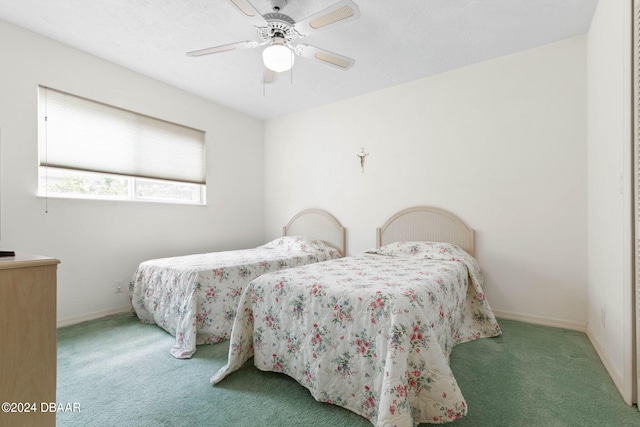 74 Kingsley Ln, Ormond Beach, FL 32174 - carpeted bedroom with baseboards and a ceiling fan