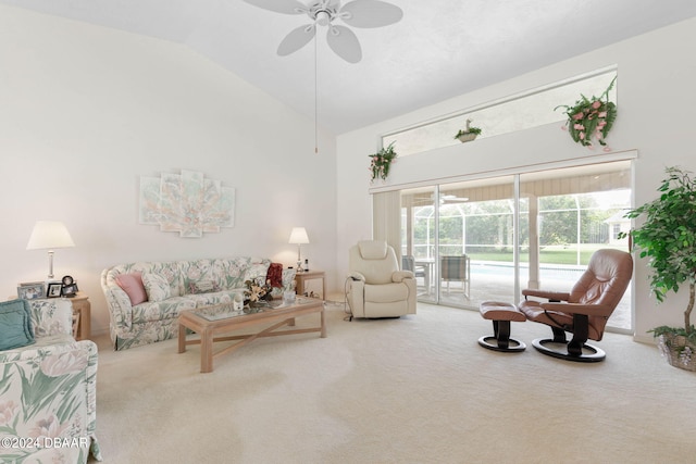 living room featuring ceiling fan, carpet flooring, and lofted ceiling