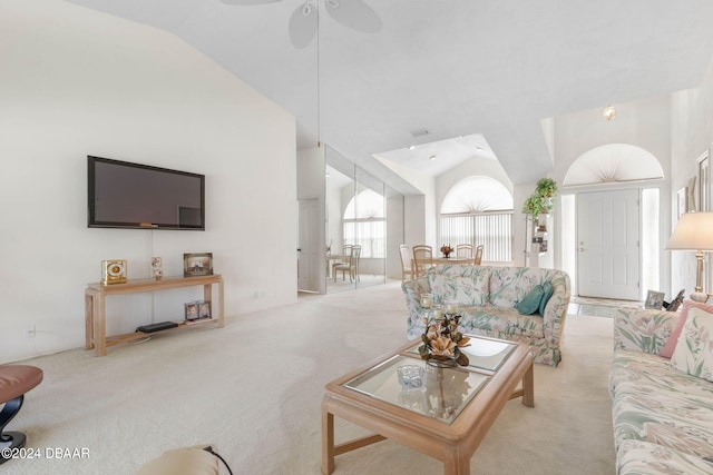 living room featuring lofted ceiling, light carpet, and ceiling fan