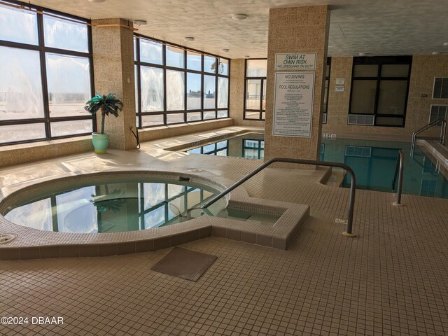 view of pool featuring an indoor in ground hot tub