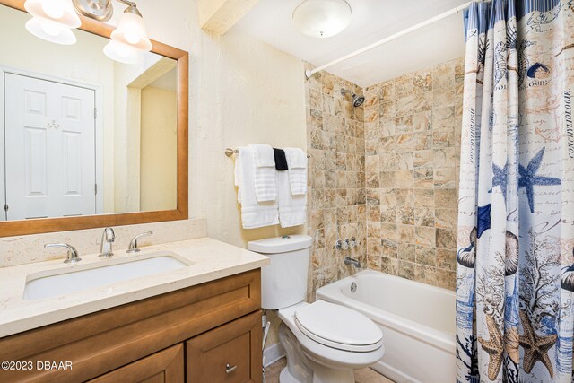 full bathroom with vanity, toilet, and shower / bath combination with curtain