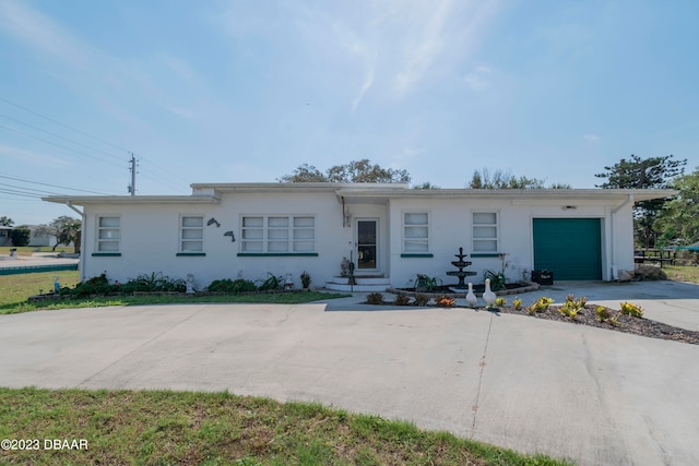 ranch-style house featuring a garage