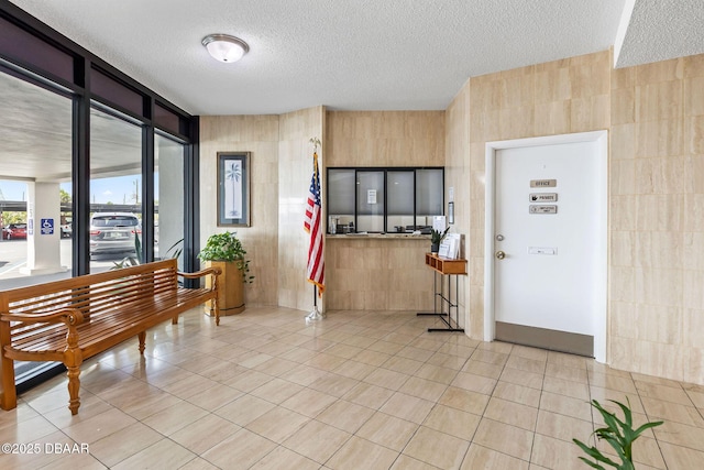 1415 Ocean Shore Blvd Unit 808, Ormond Beach, FL 32176 - foyer with a textured ceiling and light tile patterned floors