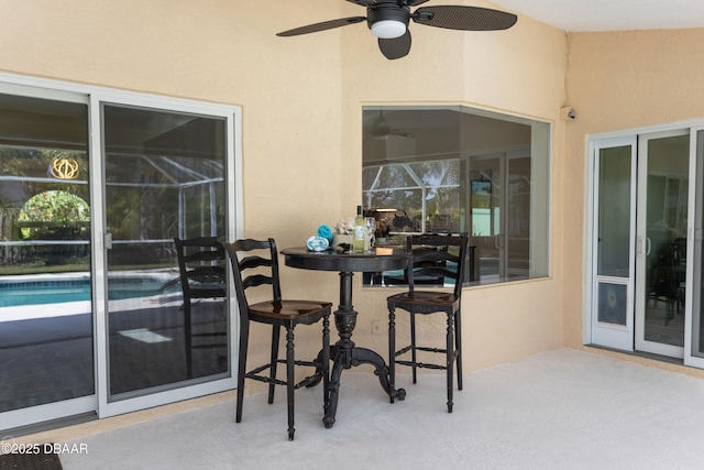 3 Seabridge Dr, Ormond Beach, FL 32176 - view of patio with a ceiling fan and an outdoor pool