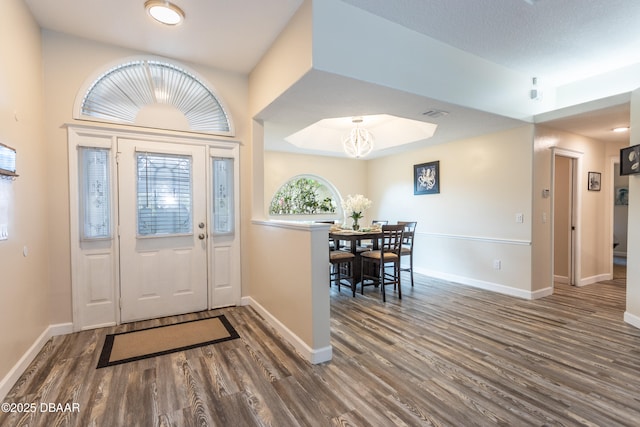 entryway featuring dark wood-type flooring