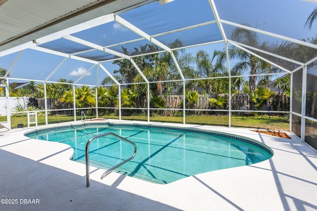 view of swimming pool featuring a lanai and a patio