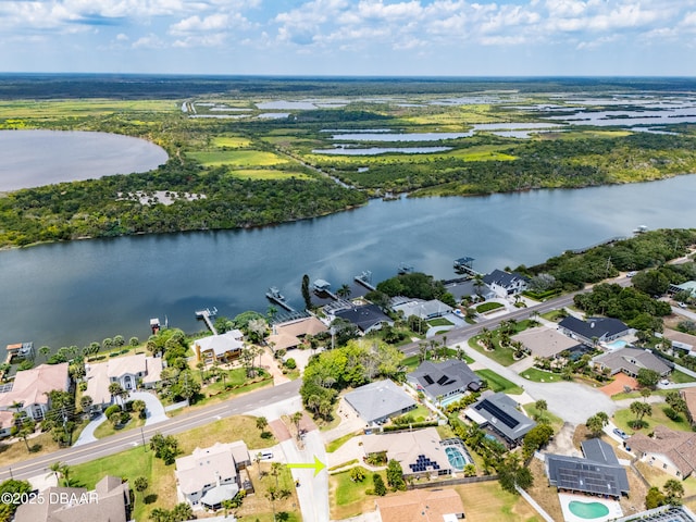 bird's eye view with a water view