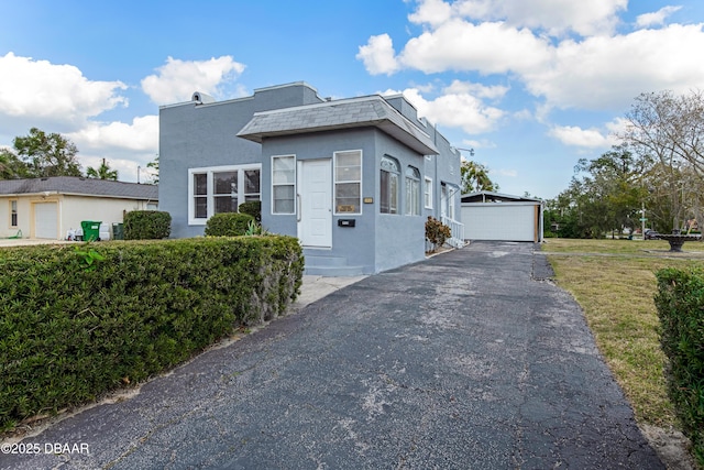 view of front of house with an outbuilding and a garage