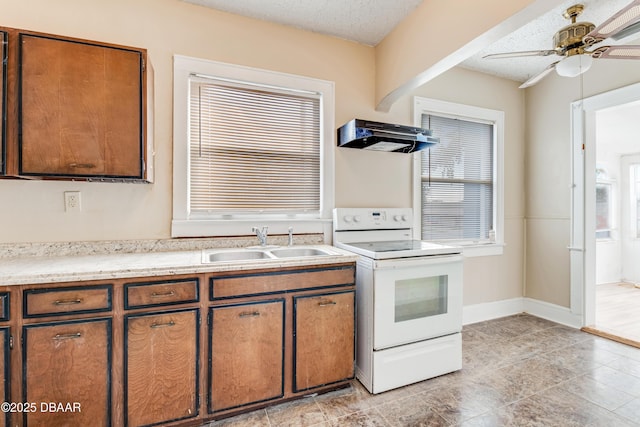 kitchen with sink, ceiling fan, electric range, extractor fan, and a textured ceiling