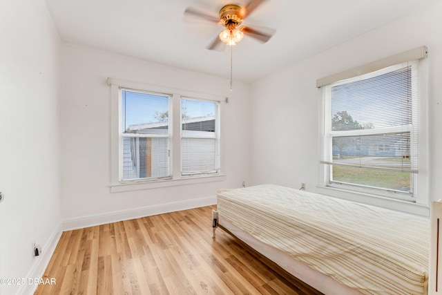 bedroom featuring wood-type flooring and ceiling fan