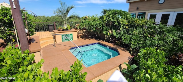 view of pool with a patio and a deck