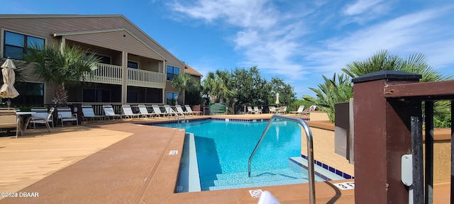 view of pool featuring a patio